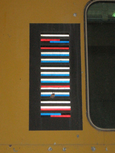 [KarTrak barcode plate]