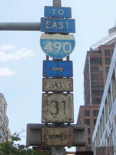 [NY 31 and I-490 signs]