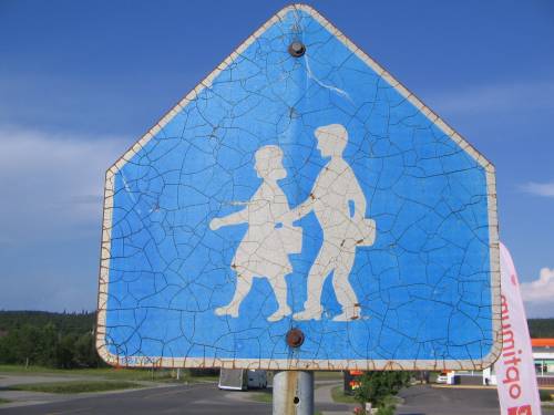 [Blue school zone sign]