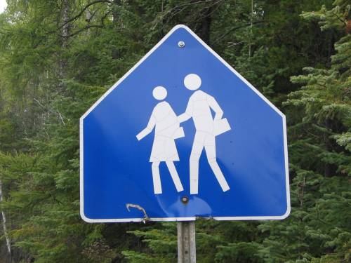 [Blue school zone sign]