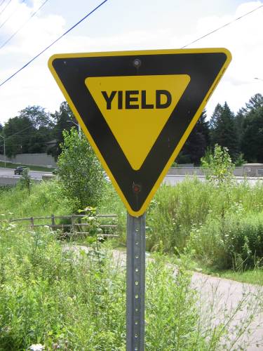 [Yellow yield sign]